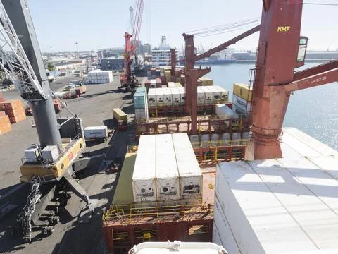View of a cargo ship loaded with containers in Table Bay, Cape Town Stock Photos