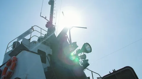 View of cargo vessel against the sun with lens flares Stock Footage 105882433