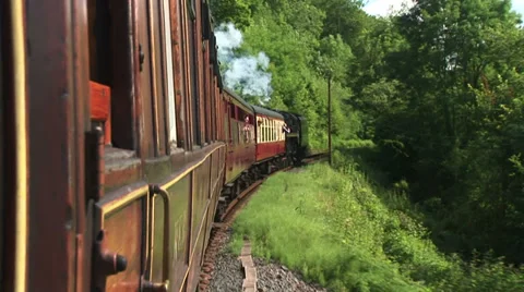 View from carriage of Steam train as it moves along the track Видео 39890422