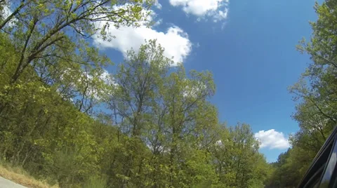 View from car's side window up. Greece ,mountains,trees, clouds and sky. Stock Footage 27255174