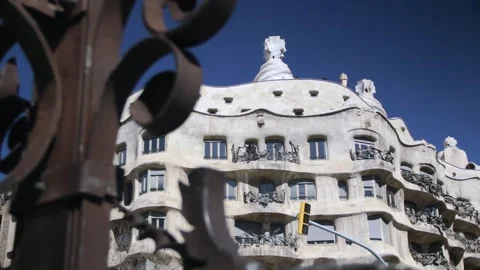 View of the Casa Mila between the slabs of the street lamp on Passeig de Gràcia Video stock 296861729