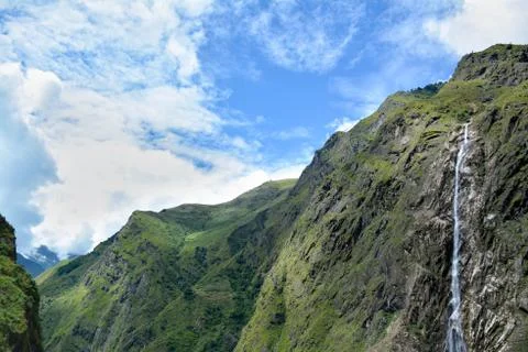 View of the cascade falling down to the gulf. Beautiful Himalayan Mountains o Stock Photos