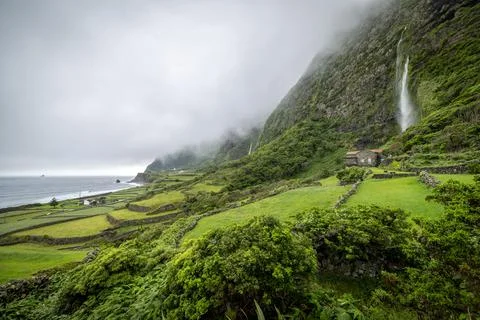 View on Cascata do Poco do Bacalhau, famous waterfall on Flores Island of A.. Stock-Fotos