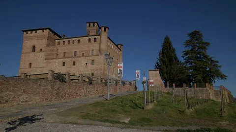 View of the Castle of Grinzane Cavour and the green vineyards Stock Footage 106193386