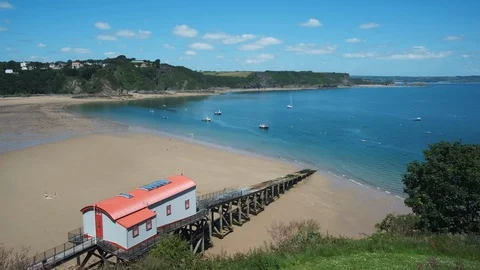 View from Castle Hill to North Beach and Old Life Boat station Tenby Stock Footage 113674387
