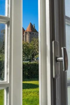 View of the castle from the open window. Stock Photos