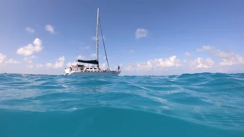 View of a catamaran in from the ocean water level Stock Footage 129389729