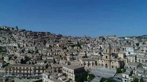 View of Cathedral flying backward revealing old town Modica in Sicily Stock Footage 179499403