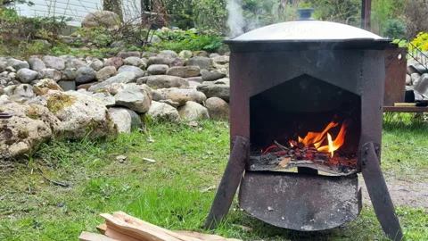 View of a cauldron over an open fire outdoors, cooking pilaf Stock-Footage 308819565