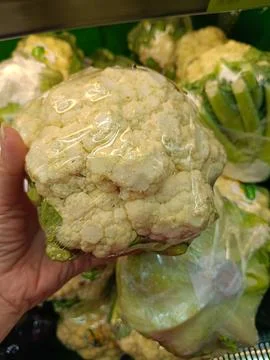 View of cauliflower vegetables in display case Stock Photos