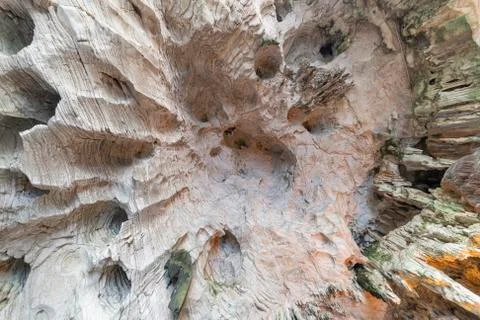 Up view of the cave ceiling showing cracks, cavities, irregularities, stalact Stock-Fotos