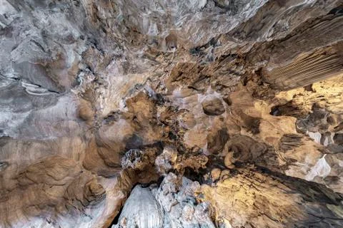 Up view of the cave ceiling showing cracks, cavities, irregularities, stalact Stock Photos