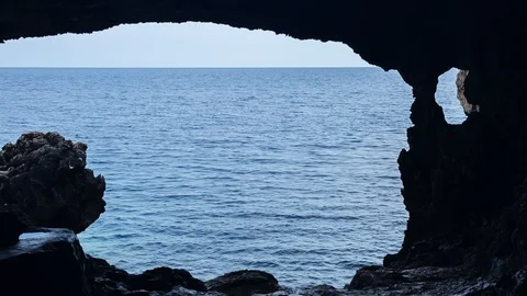 View from the cave at the ocean Stock Footage 126941255