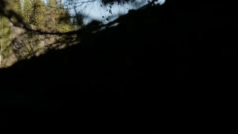 View from the cave to water surface of the lake Stock Footage 76583811