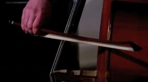 View of cellist's hands with fiddlestick Stock Footage 67523680