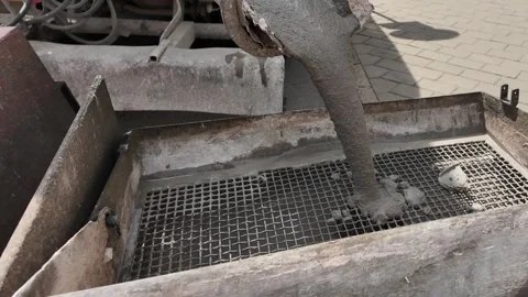 View of a cement mixer lorry. Pouring concrete from the mixer truck into a Video stock 311450377