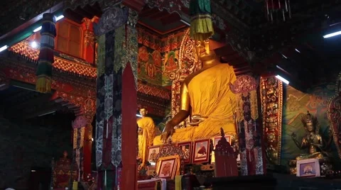 View to the central altar of the temple with the statue of Buddha Stock Footage 59013372