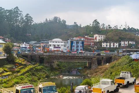 View of central Munnar with bridge, river, and commercial buildings in Kerala Fotos de archivo