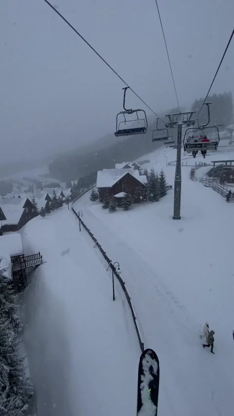 View of chair lift pine tree covered with snow ski resort Stock Footage 251864201