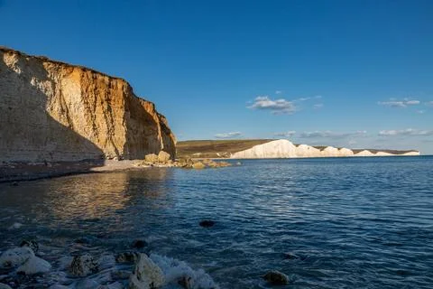 A view of the chalk Seven Sisters cliffs on the Sussex coast, with a blue s.. Stock Photos
