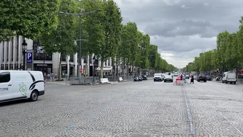View of Champs Elysees avenue with shops and traffic in Paris France Stock Footage 315360592