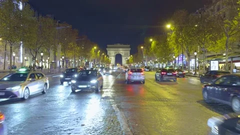 View Of Champs-Élysées Traffic And Arc De Triomphe At Night, France Stock Footage 324790243