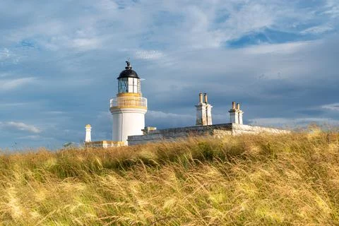 View of Chanonry Point Lighthouse at sunset in summer in Higlands of Scotland. Stock Photos
