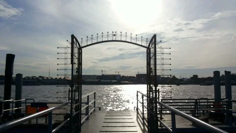 View of Chao Phraya river on sunlight reflection with gate on the pier Stock Footage 101370855