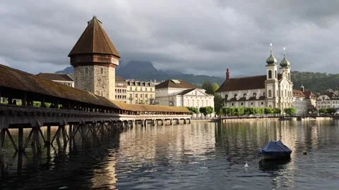 View of Chapel Bridge and Jesuit Church in Lucerne, Switzerland. Vídeos de archivo 343669349