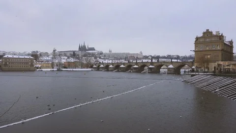 View of Charles Bridge and Castle Under the Snow in Winter  Stock Footage 72098285