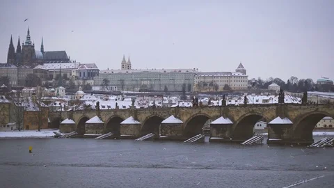 View of Charles Bridge and Castle in Prague Under the Snow in Winter Stock-Footage 72167654