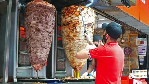 View of a chef preparing and making Traditional Turkish Doner Kebab meat. 動画素材 197311825