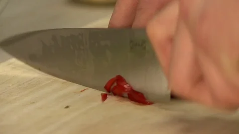 View of chef slicing red bell pepper, close-up Video stock 72568124