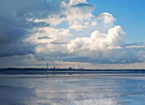 View of chemical plant across river Stock Photos