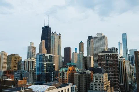 View of Chicago skyline during cloudy day showcasing buildings and urban la.. Stock Photos