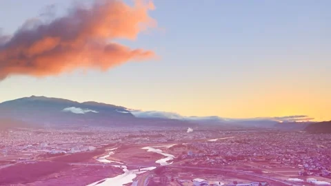 View of the Chikuma River, Ueda City, Mount Eboshi, and the Morning Sun from Vídeos de archivo 333246510