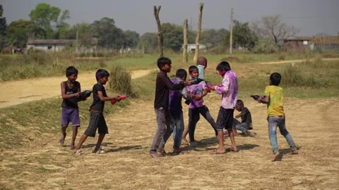 View of children playing with colored powder during Holi, Nepal. Video stock 335481226