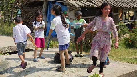 View of children playing with colors during Holi festival, Nepal. 動画素材 335480835