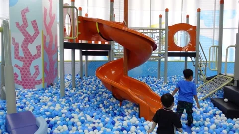 View of children playing on a slide in a children's play area Stock-Footage 275316807