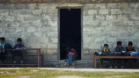 View of children studying outside a school building, Nepal. Video stock 335477184