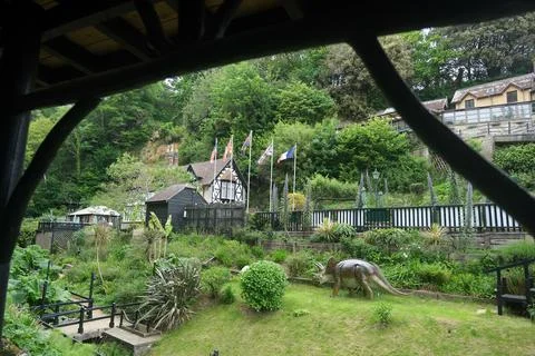 View of Chine Lodge and Commando Memorial flags among the lush gardens of S.. Stock Photos