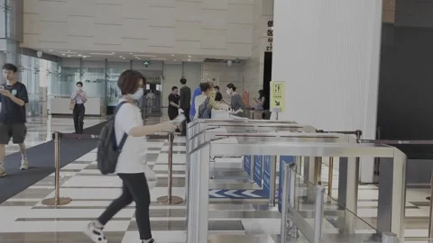 View of Chinese office building entry gate with reception desk in Video stock 243699639