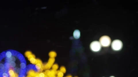 View of Christmas tree against background of snow with glowing garland . Vídeo Stock 229969214