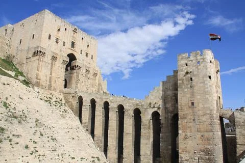 View of the citadel in Aleppo, its stone walls and magnificent gate Stock Photos
