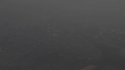 View of City From Airplane Window Stock Footage 102806001