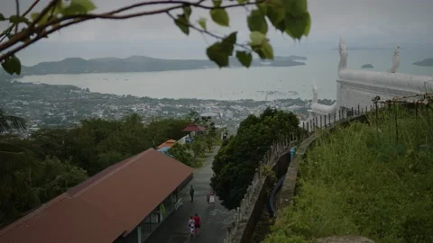 View of the city from the big Buddha statue, tourists walking below. Phuket Stock Footage 223820140