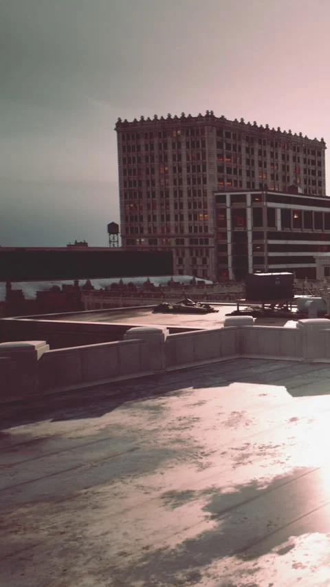 View of city buildings and rooftop area during sunset in urban setting Stock Footage 337969512