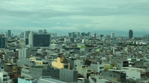 View of a city in a developing country from the top of a high-rise building Stock Footage 334636782