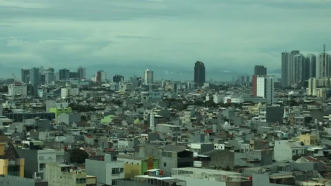 View of a city in a developing country from the top of a high-rise building Stock Footage 334636784