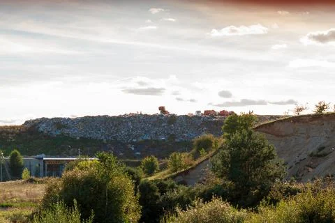 View of the city dump in the evening. Stock Photos